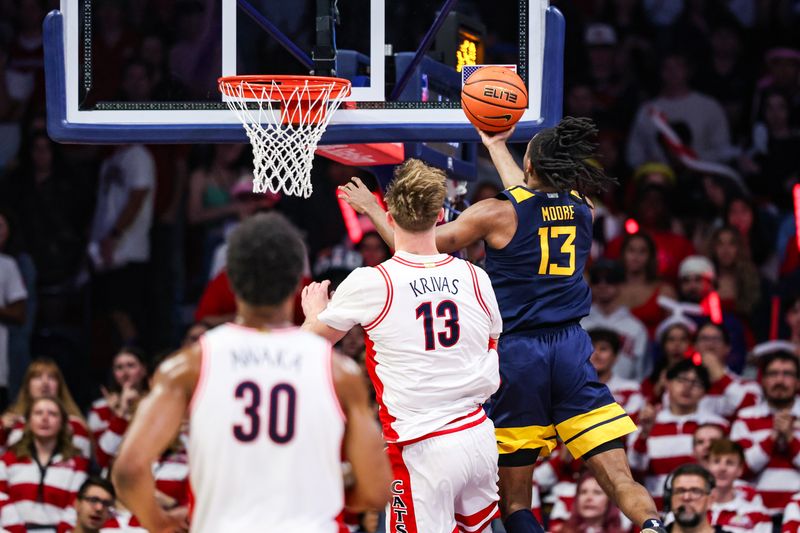 Jan 24, 2026; Tucson, Arizona, USA; West Virginia Mountaineers guard Chance Moore (13) makes a layup during the second half of the game against the Arizona Wildcats at McKale Memorial Center. Mandatory Credit: Aryanna Frank-Imagn Images