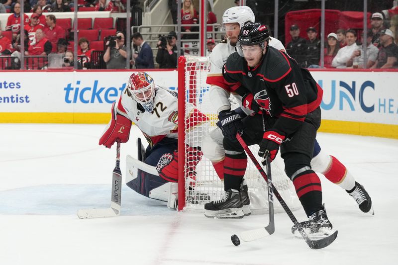 May 22, 2025; Raleigh, North Carolina, USA;  Florida Panthers goaltender Sergei Bobrovsky (72) defends against Carolina Hurricanes forward Eric Robinson (50) during the third period in game two of the Eastern Conference Final of the 2025 Stanley Cup Playoffs at Lenovo Center. Mandatory Credit: James Guillory-Imagn Images