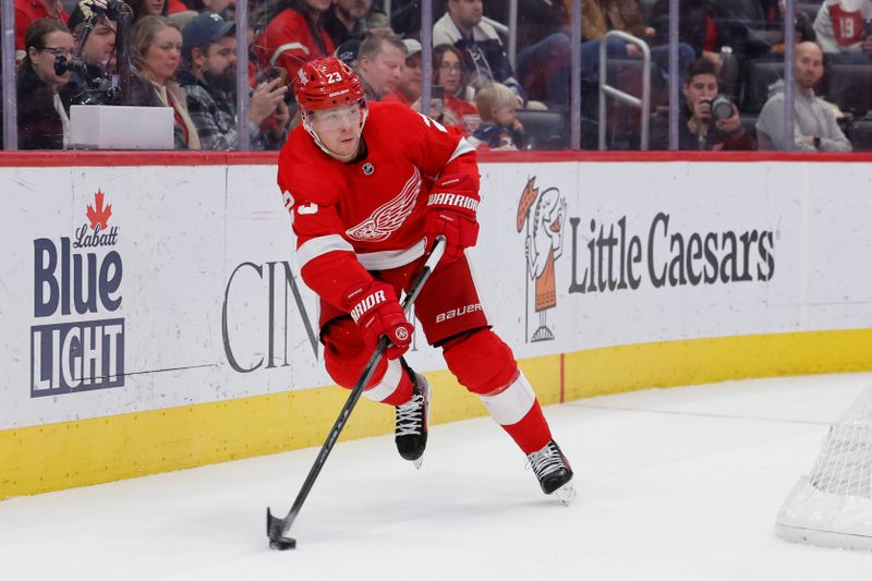 Nov 11, 2023; Detroit, Michigan, USA;  Detroit Red Wings left wing Lucas Raymond (23) skates with the puck against the Columbus Blue Jackets in the second period at Little Caesars Arena. Mandatory Credit: Rick Osentoski-USA TODAY Sports