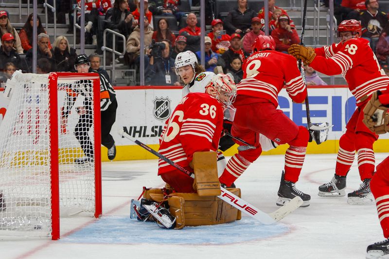 Nov 9, 2025; Detroit, Michigan, USA; Chicago Blackhawks left wing Tyler Bertuzzi (59) scores a goal on Detroit Red Wings goaltender John Gibson (36) during the third period at Little Caesars Arena. Mandatory Credit: Brian Bradshaw Sevald-Imagn Images