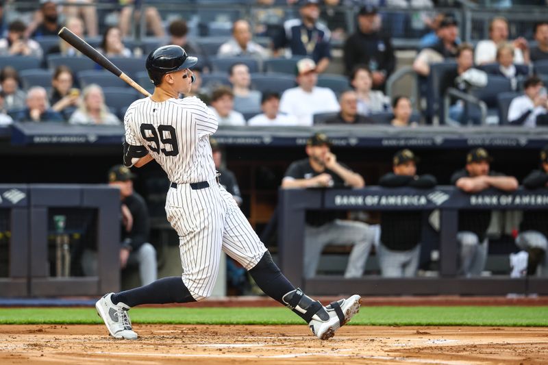 May 17, 2024; Bronx, New York, USA;  New York Yankees center fielder Aaron Judge (99) hits a solo home run in the first inning against the Chicago White Sox at Yankee Stadium. Mandatory Credit: Wendell Cruz-USA TODAY Sports