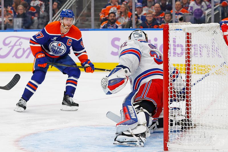 Nov 23, 2024; Edmonton, Alberta, CAN; Edmonton Oilers forward Connor McDavid (97) scores a goal on New York Rangers goaltender Jonathan Quick (32) during the third period at Rogers Place. Mandatory Credit: Perry Nelson-Imagn Images