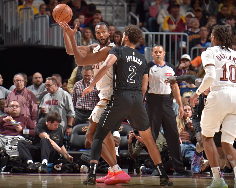 CLEVELAND, OH - NOVEMBER 9: Evan Mobley #4 of the Cleveland Cavaliers passes the ball during the game against the Brooklyn Nets on November 9, 2024 at Rocket Mortgage FieldHouse in Cleveland, Ohio. NOTE TO USER: User expressly acknowledges and agrees that, by downloading and/or using this Photograph, user is consenting to the terms and conditions of the Getty Images License Agreement. Mandatory Copyright Notice: Copyright 2024 NBAE (Photo by David Liam Kyle/NBAE via Getty Images)