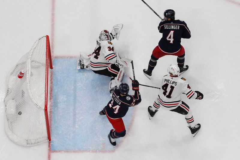 Nov 22, 2023; Columbus, Ohio, USA; Columbus Blue Jackets Forward Cole Sillinger (4) tips the puck past Chicago Blackhawks goalie Petr Mrazek (34) for a goal during the second period at Nationwide Arena. Mandatory Credit: Russell LaBounty-USA TODAY Sports