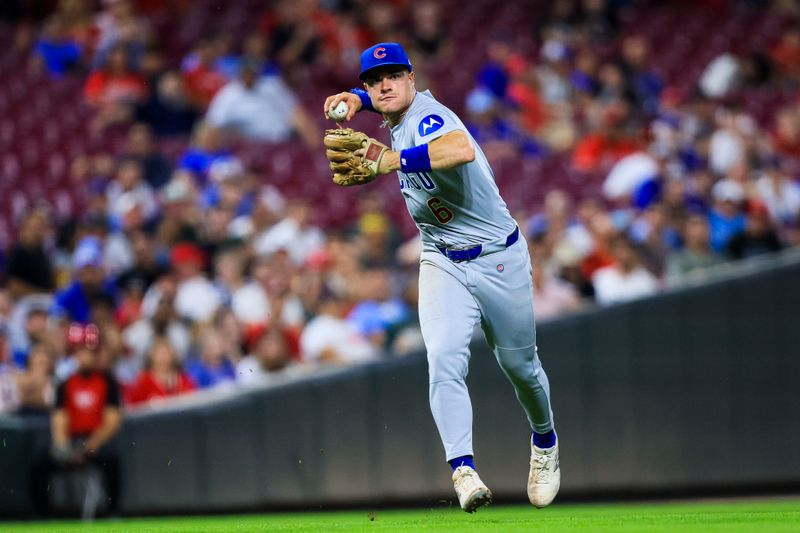 Sep 18, 2025; Cincinnati, Ohio, USA; Chicago Cubs third baseman Matt Shaw (6) throws to first to get Cincinnati Reds catcher Tyler Stephenson (not pictured) out in the eighth inning at Great American Ball Park. Mandatory Credit: Katie Stratman-Imagn Images