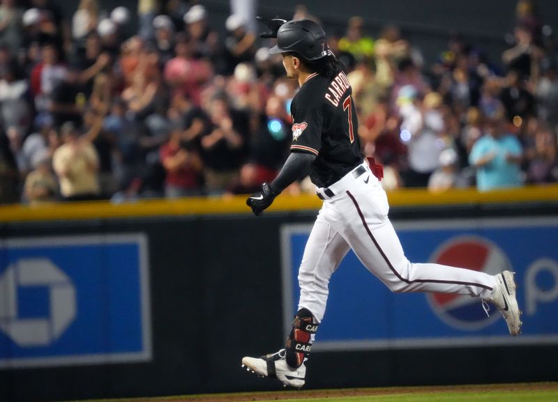 Jun 17, 2023; Phoenix, Arizona, USA; Arizona Diamondbacks Corbin Carroll (7) runs the bases after a home run against the Cleveland Guardians at Chase Field. Mandatory Credit: Joe Rondone-USA TODAY Sports