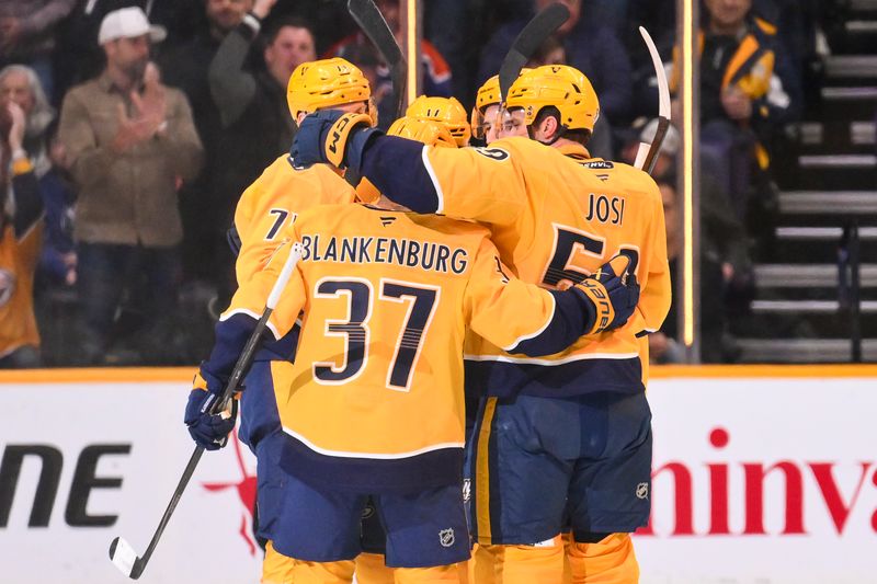 Jan 13, 2026; Nashville, Tennessee, USA;  Nashville Predators defenseman Roman Josi (59) celebrates with his teammates after scoring a goal against the Edmonton Oilers during the second period at Bridgestone Arena. Mandatory Credit: Steve Roberts-Imagn Images