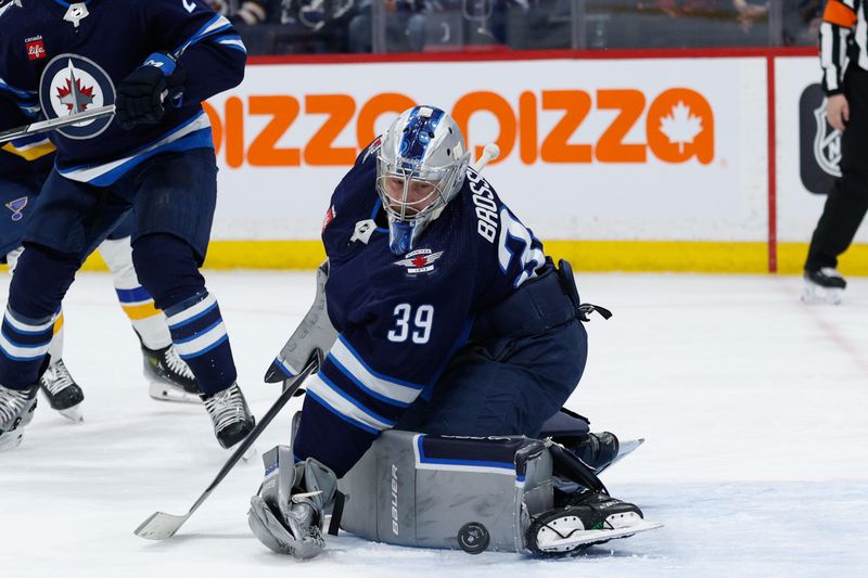 Feb 27, 2024; Winnipeg, Manitoba, CAN; Winnipeg Jets goalie Laurent Boissoit (39) makes a save against the St. Louis Blues during the first period at Canada Life Centre. Mandatory Credit: Terrence Lee-USA TODAY Sports