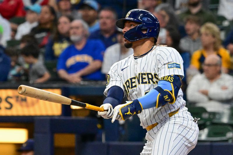 May 11, 2024; Milwaukee, Wisconsin, USA;  Milwaukee Brewers catcher William Contreras (24) hits a double against the St. Louis Cardinals in the first inning at American Family Field. Mandatory Credit: Benny Sieu-USA TODAY Sports