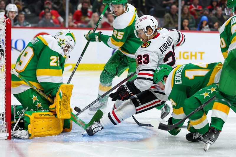 Dec 3, 2023; Saint Paul, Minnesota, USA; Minnesota Wild goaltender Marc-Andre Fleury (29) makes a save on a shot by Chicago Blackhawks center Philipp Kurashev (23) during the third period at Xcel Energy Center. Mandatory Credit: Matt Krohn-USA TODAY Sports