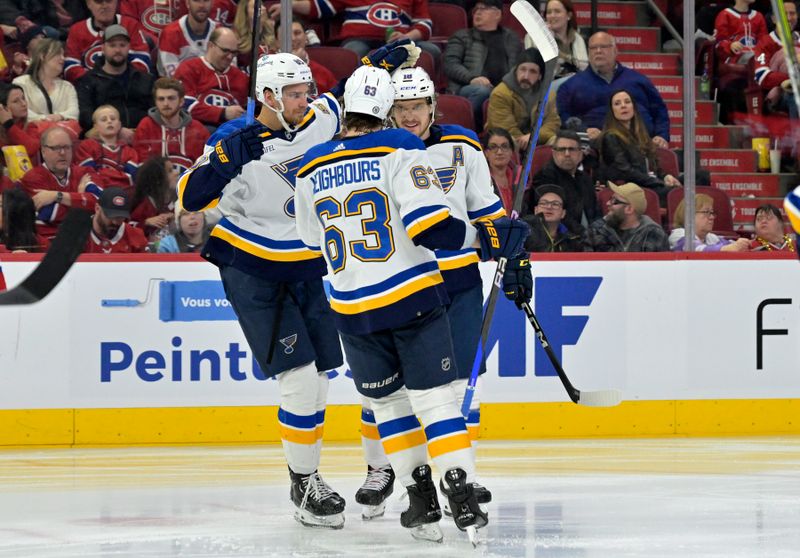 Feb 11, 2024; Montreal, Quebec, CAN; St.Louis Blues forward Nathan Walker (26) celebrates with teammates after scoring a goal against the Montreal Canadiens during the third period at the Bell Centre. Mandatory Credit: Eric Bolte-USA TODAY Sports