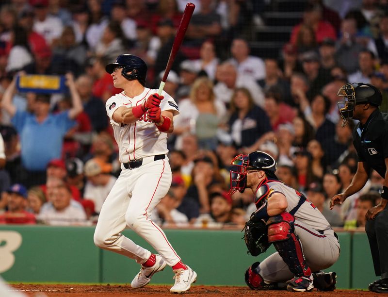 Jun 4, 2024; Boston, Massachusetts, USA; Boston Red Sox right fielder Bobby Dalbec (29) gets a base hit to drive in two runs against the Atlanta Braves in the fourth inning at Fenway Park. Mandatory Credit: David Butler II-USA TODAY Sports