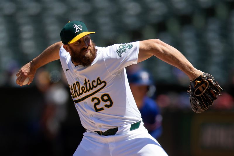May 8, 2024; Oakland, California, USA; Oakland Athletics pitcher Austin Adams (29) delivers a pitch against the Texas Rangers during the sixth inning at Oakland-Alameda County Coliseum. Mandatory Credit: D. Ross Cameron-USA TODAY Sports