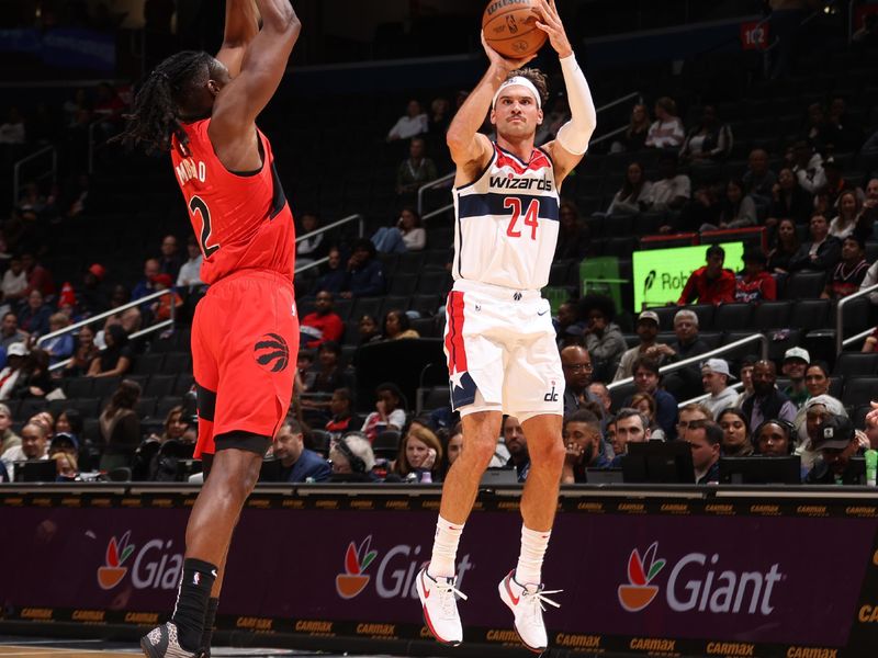 WASHINGTON, DC -? OCTOBER 11:  Corey Kispert #24 of the Washington Wizards shoots a three point basket during the game against the Toronto Raptors during a preseason game on October 11, 2024 at Capital One Arena in Washington, DC. NOTE TO USER: User expressly acknowledges and agrees that, by downloading and or using this Photograph, user is consenting to the terms and conditions of the Getty Images License Agreement. Mandatory Copyright Notice: Copyright 2024 NBAE (Photo by Kenny Giarla/NBAE via Getty Images)