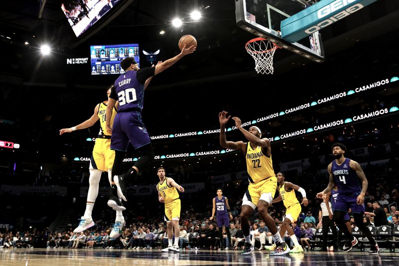 CHARLOTTE, NORTH CAROLINA - FEBRUARY 12: Seth Curry #30 of the Charlotte Hornets lays the ball up during the first half of an NBA game against the Indiana Pacers at Spectrum Center on February 12, 2024 in Charlotte, North Carolina. NOTE TO USER: User expressly acknowledges and agrees that, by downloading and or using this photograph, User is consenting to the terms and conditions of the Getty Images License Agreement. (Photo by David Jensen/Getty Images)
