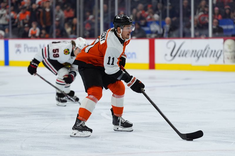 Nov 23, 2024; Philadelphia, Pennsylvania, USA; Philadelphia Flyers right wing Travis Konecny (11) controls the puck against the Chicago Blackhawks in the first period at Wells Fargo Center. Mandatory Credit: Kyle Ross-Imagn Images