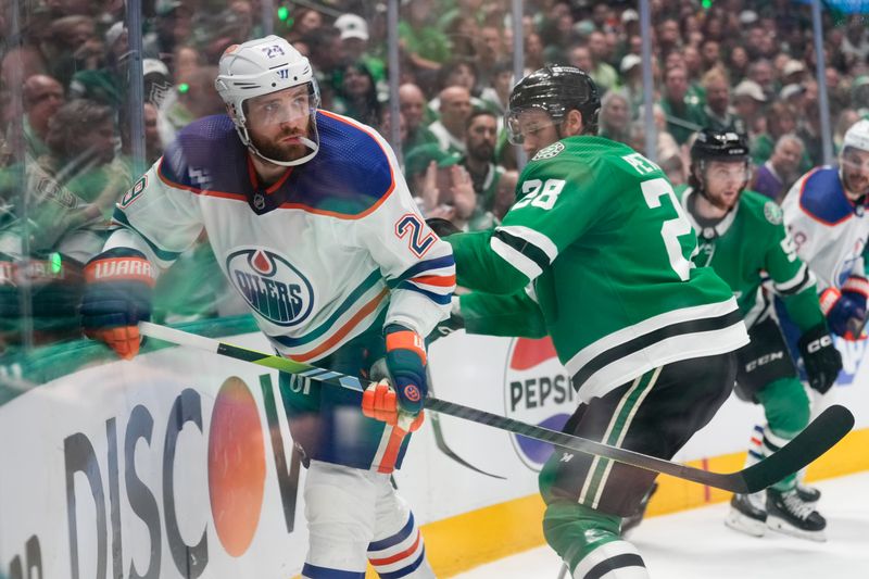 May 31, 2024; Dallas, Texas, USA; Edmonton Oilers center Leon Draisaitl (29) is checked by Dallas Stars defenseman Alexander Petrovic (28) during the first period between the Dallas Stars and the Edmonton Oilers in game five of the Western Conference Final of the 2024 Stanley Cup Playoffs at American Airlines Center. Mandatory Credit: Chris Jones-USA TODAY Sports