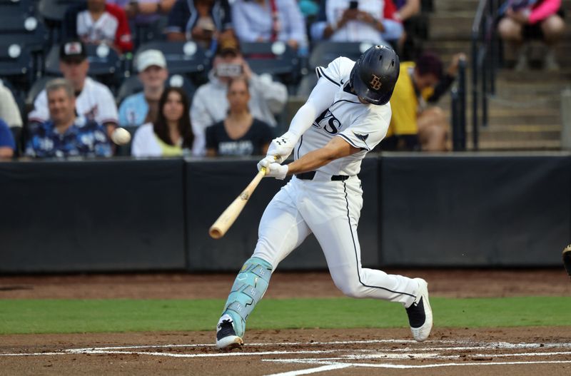 Jun 4, 2025; St. Petersburg, Florida, USA;  Tampa Bay Rays second base Brandon Lowe (8) hits a home run against the Texas Rangers during the first inning at George M. Steinbrenner Field. Mandatory Credit: Kim Klement Neitzel-Imagn Images