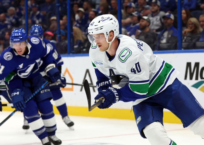 Oct 15, 2024; Tampa, Florida, USA; Vancouver Canucks center Elias Pettersson (40) against the Tampa Bay Lightning during the third period at Amalie Arena. Mandatory Credit: Kim Klement Neitzel-Imagn Images