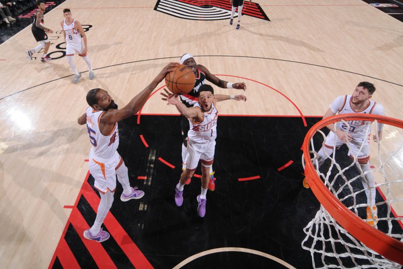 PORTLAND, OR - JANUARY 14: Kevin Durant #35 and Devin Booker #1 of the Phoenix Suns rebounds the ball during the game against the Portland Trail Blazers on January 14, 2024 at the Moda Center Arena in Portland, Oregon. NOTE TO USER: User expressly acknowledges and agrees that, by downloading and or using this photograph, user is consenting to the terms and conditions of the Getty Images License Agreement. Mandatory Copyright Notice: Copyright 2024 NBAE (Photo by Cameron Browne/NBAE via Getty Images)