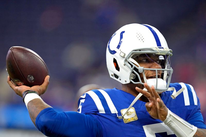 Indianapolis Colts quarterback Anthony Richardson (5) warms up before an NFL football game against the Buffalo Bills, Sunday, Nov. 10, 2024, in Indianapolis. (AP Photo/Darron Cummings)