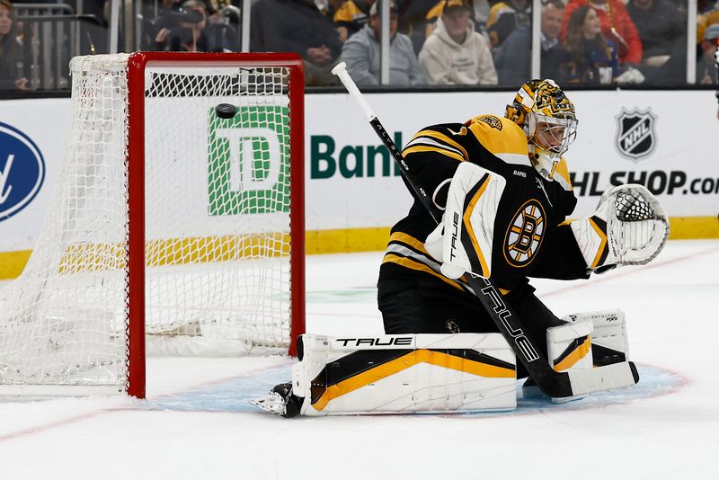 Oct 14, 2024; Boston, Massachusetts, USA; A shot by Florida Panthers center Sam Reinhart (13) gets past Boston Bruins goaltender Jeremy Swayman (1) for a goal during the first period at TD Garden. Mandatory Credit: Winslow Townson-Imagn Images