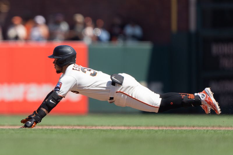 Aug 13, 2023; San Francisco, California, USA; San Francisco Giants second baseman Thairo Estrada (39) slides during the eighth inning against the Texas Rangers at Oracle Park. Mandatory Credit: Stan Szeto-USA TODAY Sports