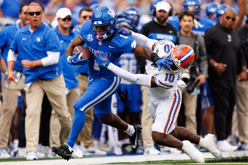 Sep 30, 2023; Lexington, Kentucky, USA; Kentucky Wildcats running back Ray Davis (1) is pushed out of bounds by Florida Gators safety Miguel Mitchell (10) during the first quarter at Kroger Field. Mandatory Credit: Jordan Prather-USA TODAY Sports