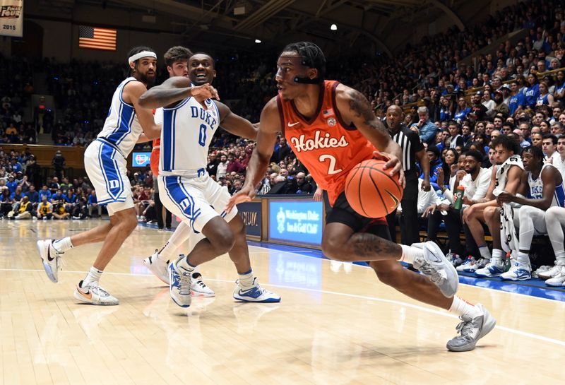 Feb 25, 2023; Durham, North Carolina, USA; Virginia Tech Hokies guard MJ Collins (2) drives to the basket as Duke Blue Devils forward Dariq Whitehead (0) defends during the first half at Cameron Indoor Stadium. Mandatory Credit: Rob Kinnan-USA TODAY Sports