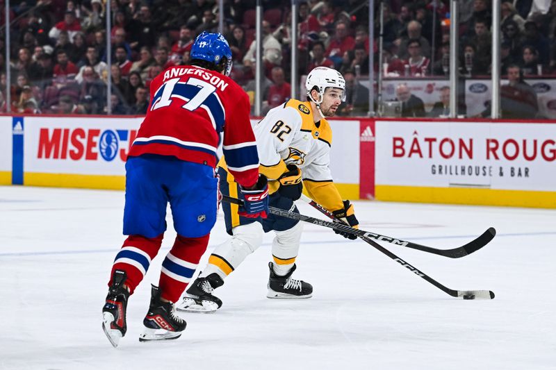 Dec 10, 2023; Montreal, Quebec, CAN; Nashville Predators center Tommy Novak (82) plays the puck against Montreal Canadiens right wing Josh Anderson (17) during the second period at Bell Centre. Mandatory Credit: David Kirouac-USA TODAY Sports