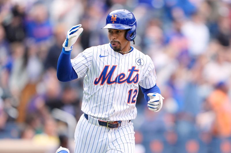 Jun 1, 2025; New York City, New York, USA; New York Mets shortstop Francisco Lindor (12) reacts to hitting a home run against the Colorado Rockies during the fifth inning at Citi Field. Mandatory Credit: Gregory Fisher-Imagn Images
