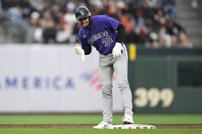 May 1, 2025; San Francisco, California, USA; Colorado Rockies shortstop Alan Trejo (31) celebrates his double against the San Francisco Giants in the third inning at Oracle Park. Mandatory Credit: Eakin Howard-Imagn Images