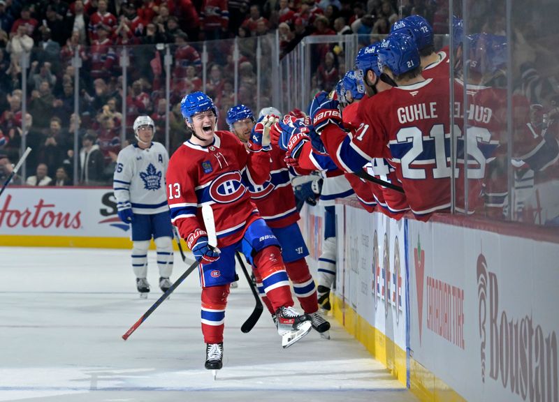 Oct 9, 2024; Montreal, Quebec, CAN; Montreal Canadiens forward Cole Caufield (13) celebrates with teammates after scoring a goal against the Toronto Maple Leafs during the first period at the Bell Centre. Mandatory Credit: Eric Bolte-Imagn Images