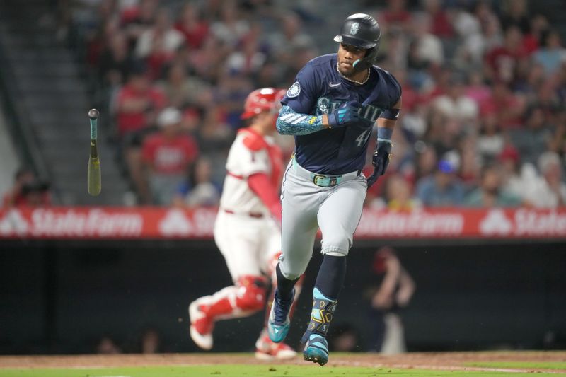 Aug 31, 2024; Anaheim, California, USA; Seattle Mariners center fielder Julio Rodriguez (44) hits a two-run single in the fourth inning against the Los Angeles Angels at Angel Stadium. Mandatory Credit: Kirby Lee-USA TODAY Sports