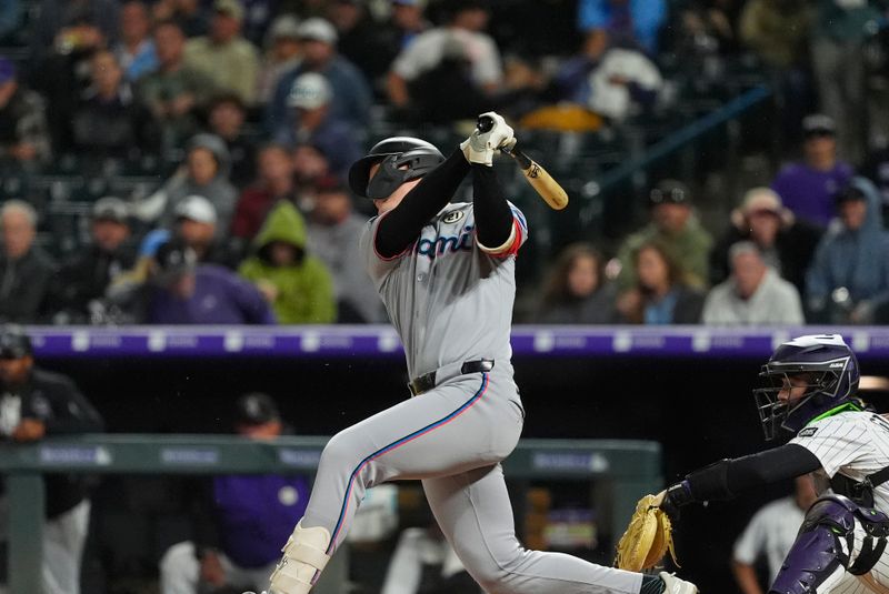 Sep 16, 2025; Denver, Colorado, USA; Miami Marlins first baseman Eric Wagaman (33) singles in the sixth inning against the Colorado Rockies at Coors Field. Mandatory Credit: Ron Chenoy-Imagn Images