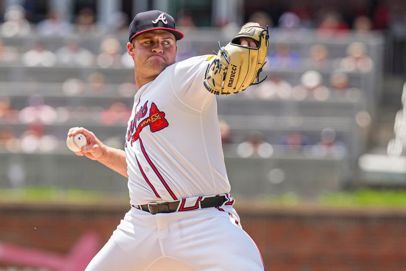 Apr 26, 2024; Cumberland, Georgia, USA; Atlanta Braves starting pitcher Bryce Elder (55) pitches against the Cleveland Guardians during the first inning at Truist Park. Mandatory Credit: Dale Zanine-USA TODAY Sports