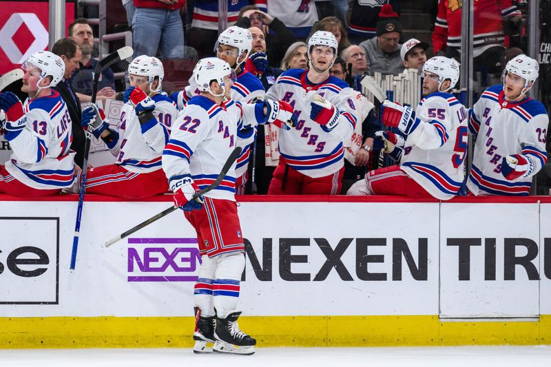 Feb 9, 2024; Chicago, Illinois, USA; New York Rangers center Jonny Brodzinski (22) celebrates his goal with teammates against the Chicago Blackhawks during the second period at the United Center. Mandatory Credit: Daniel Bartel-USA TODAY Sports