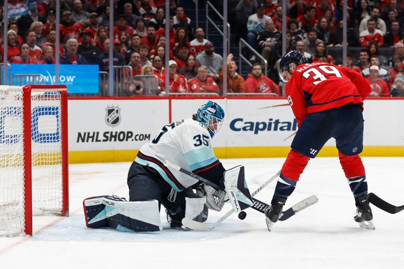 Jan 11, 2024; Washington, District of Columbia, USA; Seattle Kraken goaltender Joey Daccord (35) makes a save on Washington Capitals right wing Anthony Mantha (39) in the third period at Capital One Arena. Mandatory Credit: Geoff Burke-USA TODAY Sports