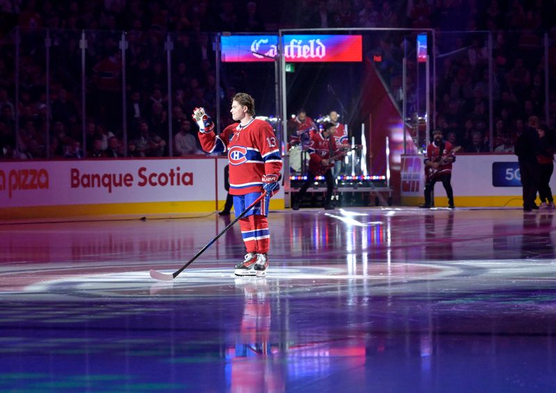 Oct 9, 2024; Montreal, Quebec, CAN; Montreal Canadiens forward Cole Caufield (13) during the player introduction ceremony before the game against the Toronto Maple Leafs at the Bell Centre. Mandatory Credit: Eric Bolte-Imagn Images