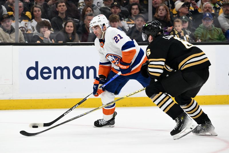 Nov 9, 2023; Boston, Massachusetts, USA; New York Islanders center Kyle Palmieri (21) skates against Boston Bruins defenseman Mason Lohrei (6) during the second period at the TD Garden. Mandatory Credit: Brian Fluharty-USA TODAY Sports