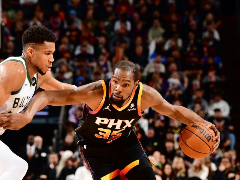 PHOENIX, AZ - FEBRUARY 6:  Kevin Durant #35 of the Phoenix Suns handles the ball during the game  on February 6, 2024 at Footprint Center in Phoenix, Arizona. NOTE TO USER: User expressly acknowledges and agrees that, by downloading and or using this photograph, user is consenting to the terms and conditions of the Getty Images License Agreement. Mandatory Copyright Notice: Copyright 2024 NBAE (Photo by Barry Gossage/NBAE via Getty Images)