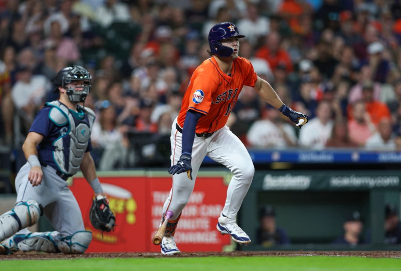 May 3, 2024; Houston, Texas, USA; Houston Astros left fielder Joey Loperfido (10) hits a single during the third inning against the Seattle Mariners at Minute Maid Park. Mandatory Credit: Troy Taormina-USA TODAY Sports