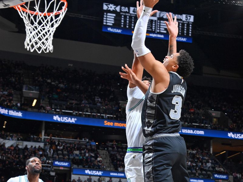 SAN ANTONIO, TX - JANUARY 27: Keldon Johnson #3 of the San Antonio Spurs drives to the basket during the game against the Minnesota Timberwolves on January 27, 2024 at the Frost Bank Center in San Antonio, Texas. NOTE TO USER: User expressly acknowledges and agrees that, by downloading and or using this photograph, user is consenting to the terms and conditions of the Getty Images License Agreement. Mandatory Copyright Notice: Copyright 2024 NBAE (Photos by Michael Gonzales/NBAE via Getty Images)