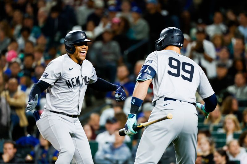 Sep 17, 2024; Seattle, Washington, USA; New York Yankees right fielder Juan Soto (22) celebrates a two-run home run against the Seattle Mariners with designated hitter Aaron Judge (99) during the fourth inning at T-Mobile Park. Mandatory Credit: Joe Nicholson-Imagn Images