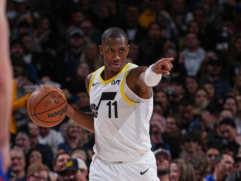 DENVER, CO - MARCH 9: Kris Dunn #11 of the Utah Jazz dribbles the ball during the game against the Denver Nuggets on March 9, 2024 at the Ball Arena in Denver, Colorado. NOTE TO USER: User expressly acknowledges and agrees that, by downloading and/or using this Photograph, user is consenting to the terms and conditions of the Getty Images License Agreement. Mandatory Copyright Notice: Copyright 2024 NBAE (Photo by Garrett Ellwood/NBAE via Getty Images)