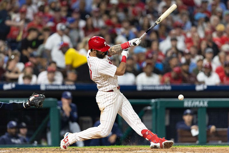 Sep 11, 2024; Philadelphia, Pennsylvania, USA; Philadelphia Phillies outfielder Weston Wilson (37) hits an infield RBI single during the sixth inning against the Tampa Bay Rays at Citizens Bank Park. Mandatory Credit: Bill Streicher-Imagn Images