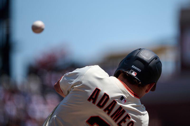 May 4, 2025; San Francisco, California, USA; San Francisco Giants shortstop Willy Adames (2) hits a one run home run against the Colorado Rockies during the first inning at Oracle Park. Mandatory Credit: Robert Edwards-Imagn Images