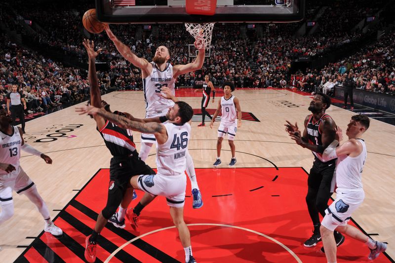PORTLAND, OR - NOVEMBER 10: Jay Huff #30 of the Memphis Grizzlies blocks the ball during the game against the Portland Trail Blazers on November 10, 2024 at the Moda Center Arena in Portland, Oregon. NOTE TO USER: User expressly acknowledges and agrees that, by downloading and or using this photograph, user is consenting to the terms and conditions of the Getty Images License Agreement. Mandatory Copyright Notice: Copyright 2024 NBAE (Photo by Cameron Browne/NBAE via Getty Images)