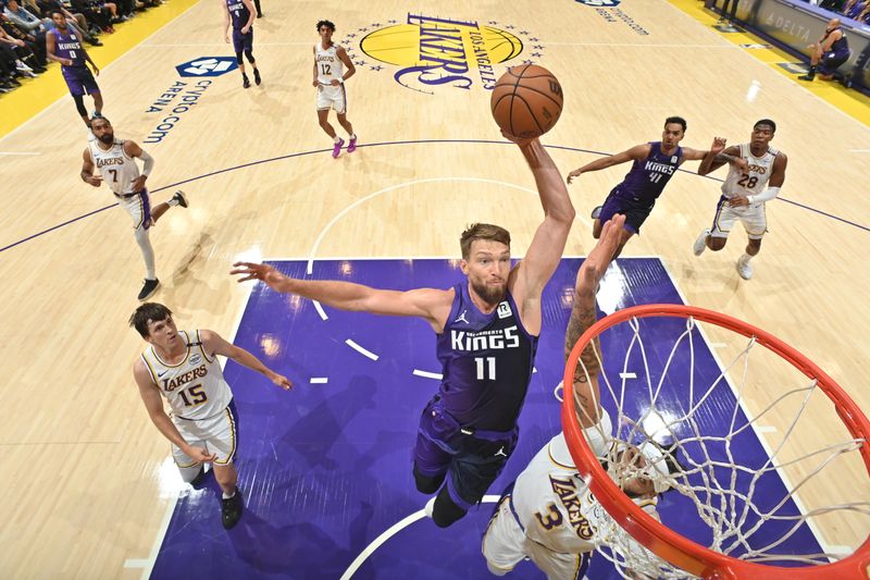 LOS ANGELES, CA - OCTOBER 26: Domantas Sabonis #11 of the Sacramento Kings dunks the ball during the game against the Los Angeles Lakers on October 26, 2024 at Crypto.Com Arena in Los Angeles, California. NOTE TO USER: User expressly acknowledges and agrees that, by downloading and/or using this Photograph, user is consenting to the terms and conditions of the Getty Images License Agreement. Mandatory Copyright Notice: Copyright 2024 NBAE (Photo by Adam Pantozzi/NBAE via Getty Images)