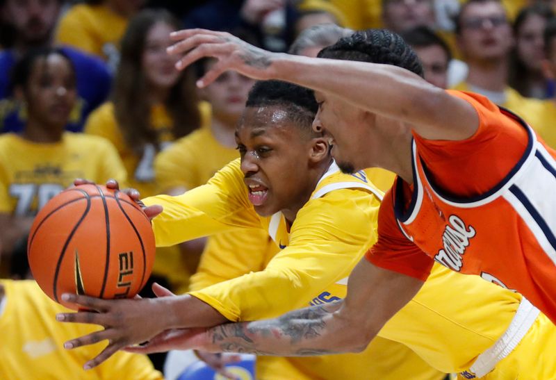 Jan 16, 2024; Pittsburgh, Pennsylvania, USA; Pittsburgh Panthers guard Carlton Carrington (rear) and Syracuse Orange guard Judah Mintz (front) chase a loose ball during the first half at the Petersen Events Center. Mandatory Credit: Charles LeClaire-USA TODAY Sports